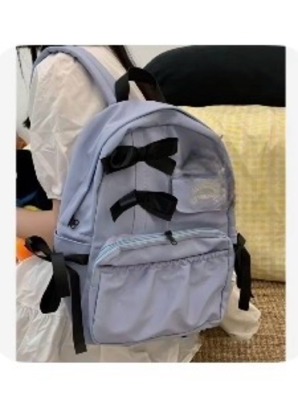 Kids light blue Backpack with Black Bow Accents light yellow inside of the bag